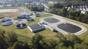 Aerial view of the Saline Creek Regional Wastewater Treatment Facility in Fenton, MO, showcasing its upgraded treatment basins and buildings.
